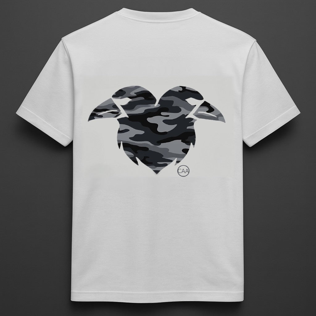 White t-shirt with a camouflage heart design on the back against a dark background