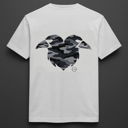 White t-shirt with a camouflage heart design on the back against a dark background